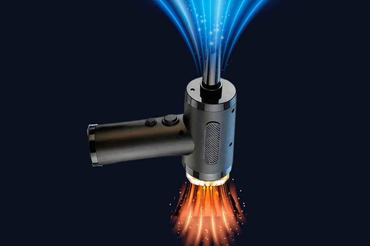 Hot air gun with blue and orange flames on a black background